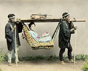 Geisha in travelling chair, Japan