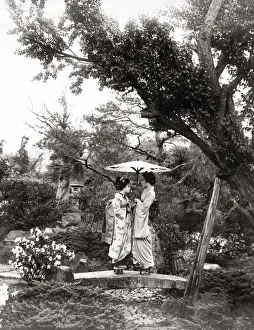 Two geishas under a parasol, Japan, c. 1890