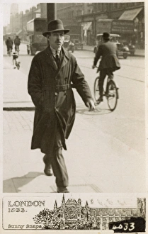 Images Dated 1st June 2017: Gent in Raincoat and trilby hat strides along London street