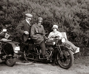 Gentlemen & lady on vintage motorcycle combination at roadsi Gentlemen & lady on vintage motorcycle combination at roadsi