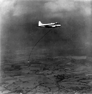 Towed Prints: A geophysical survey bird towed by de Havilland DH104 Dove