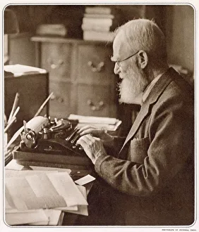 George Bernard Shaw (1856 - 1950), Irish playwright, critic, polemicist and political activist. Photograph showing Bernard Shaw at his typewriter when he was 82 years old. Date: 1939