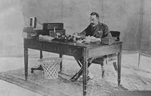 George V working in a tent