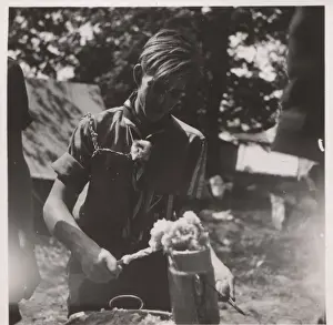 German boy scout cooking at camp