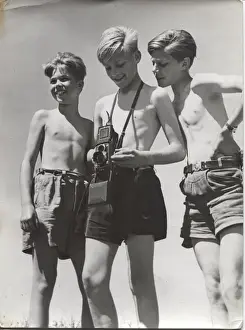 Three German boy scouts on an outdoor activity