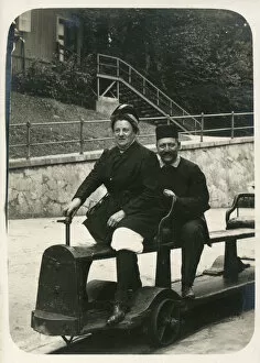 Images Dated 20th April 2020: A German couple on a fun miniature railway ride, possibly at the seaside