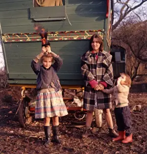 Gipsy family outside their caravan