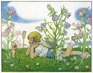 Fairies Collection: Girl with a baby fairy lying in the garden in summer