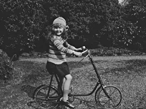 Gravel Prints: Girl on a bicycle in a garden