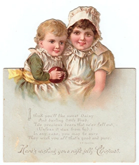 Girl and boy on a cutout Christmas card Girl and boy on a cutout Christmas card