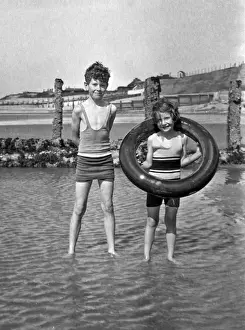Rubber Prints: Girl and boy paddling at the seaside