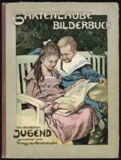 Girl and boy reading on a bench