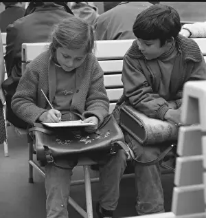 Note Book Prints: Girl and boy with their school satchels