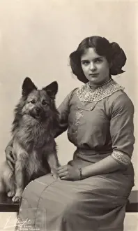 Girl with dog in studio photo