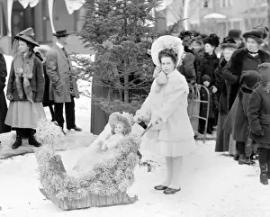Carnival Prints: Girl with doll on sleds at the Midwinter carnival children s