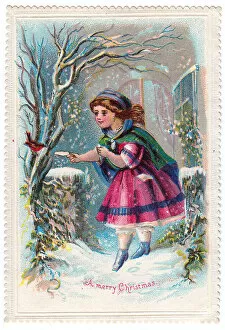 Girl giving food to a robin on a Christmas card