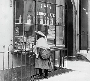 Girl looking in sweet shop window Victorian period