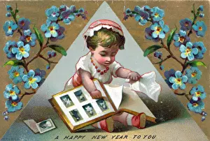 Girl with picture album on a New Year postcard