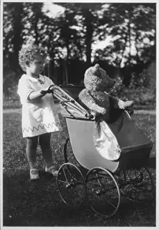 Pushes Prints: Girl Pushs Ted in Pram