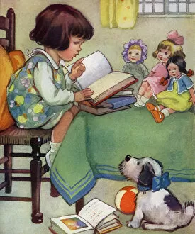 Girl reading to her dolls