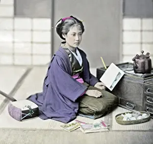 Letter Prints: Girl reading a letter beside a stove, Japan, circa 1880s. Date: circa 1880s