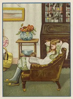 GIRL READS IN ARMCHAIR