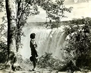 Images Dated 2nd January 2019: Girl standing by Victoria Falls, southern Africa