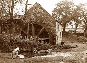Girl by a water mill