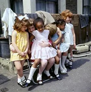 Huddling Prints: Six girls on a Balham street, SW London