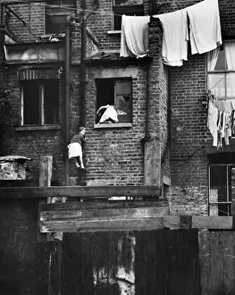 Scruffy Prints: Two girls climbing drainpipe, Balham, SW London