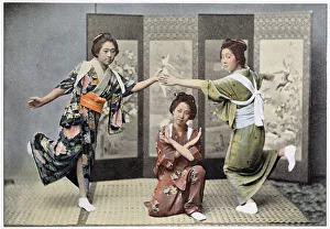 Images Dated 30th March 2021: Three girls dance in the privacy of their own home, posing rather awkwardly for