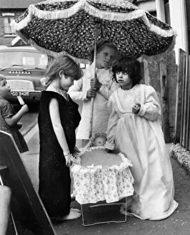 Girls with doll and parasol, Balham, SW London
