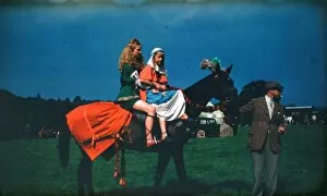 Images Dated 3rd April 2017: Two girls at a fair in medieval costume on horseback