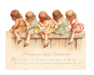 Five girls on a fence on a cutout Christmas card
