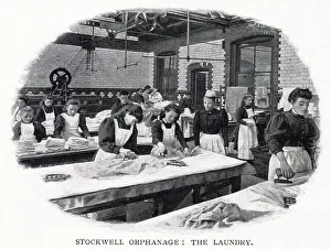 Girls learning how to do laundry correctly, maybe to do domestic work when leaving the orphanage. Date: 1900