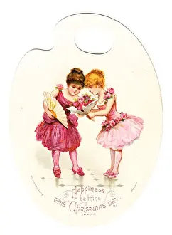 Two girls in pink on a palette-shaped Christmas card