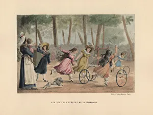 Girls playing the game of hoops in the Gardens Girls playing the game of hoops in the Gardens