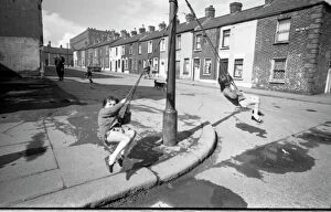 Images Dated 11th September 2015: Girls playing in Milton Street, Belfast, Northern Ireland