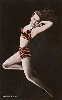 Beachwear Prints: Glamorous American model in tiger-print bikini