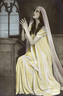 Pious Gallery: Glamorous French beauty in pious pose
