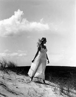 Glamour girl on sand dunes in Cornwall