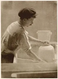 Potters Prints: Glazing ware: a dipper at work in the dipping room. Date: 1913
