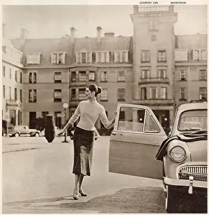 Gleneagles Prints: The Gleneagles Hotel - A glamorous model in trendy knitwear at the front of the hotel getting into her car