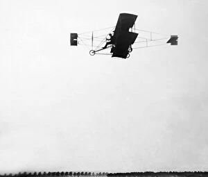 Curtis Collection: Glenn Curtis flying a Wright Bros plane