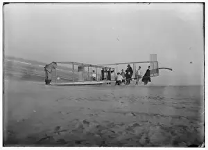 Assistants Prints: Glider being prepared for flight by Orville and assistants