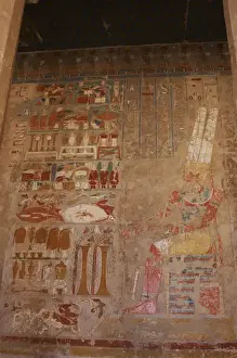 The god Amon, sitting at a table of offerings. Temple of Hat
