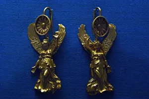 Earring Prints: Golden earrings with shaped like a Nike