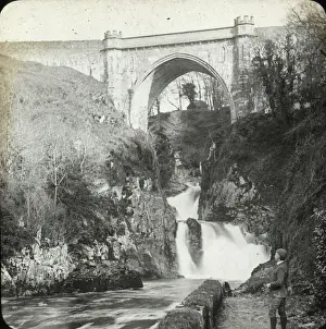 Gothic arch over a picturesque waterfall in Wales