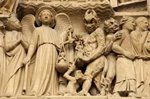 Hell Gallery: Gothic Art. France. Paris. Notre Dame. Facade. the archangel