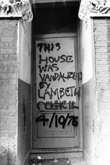 Problems Prints: Graffitti on front door, Lambeth, South London